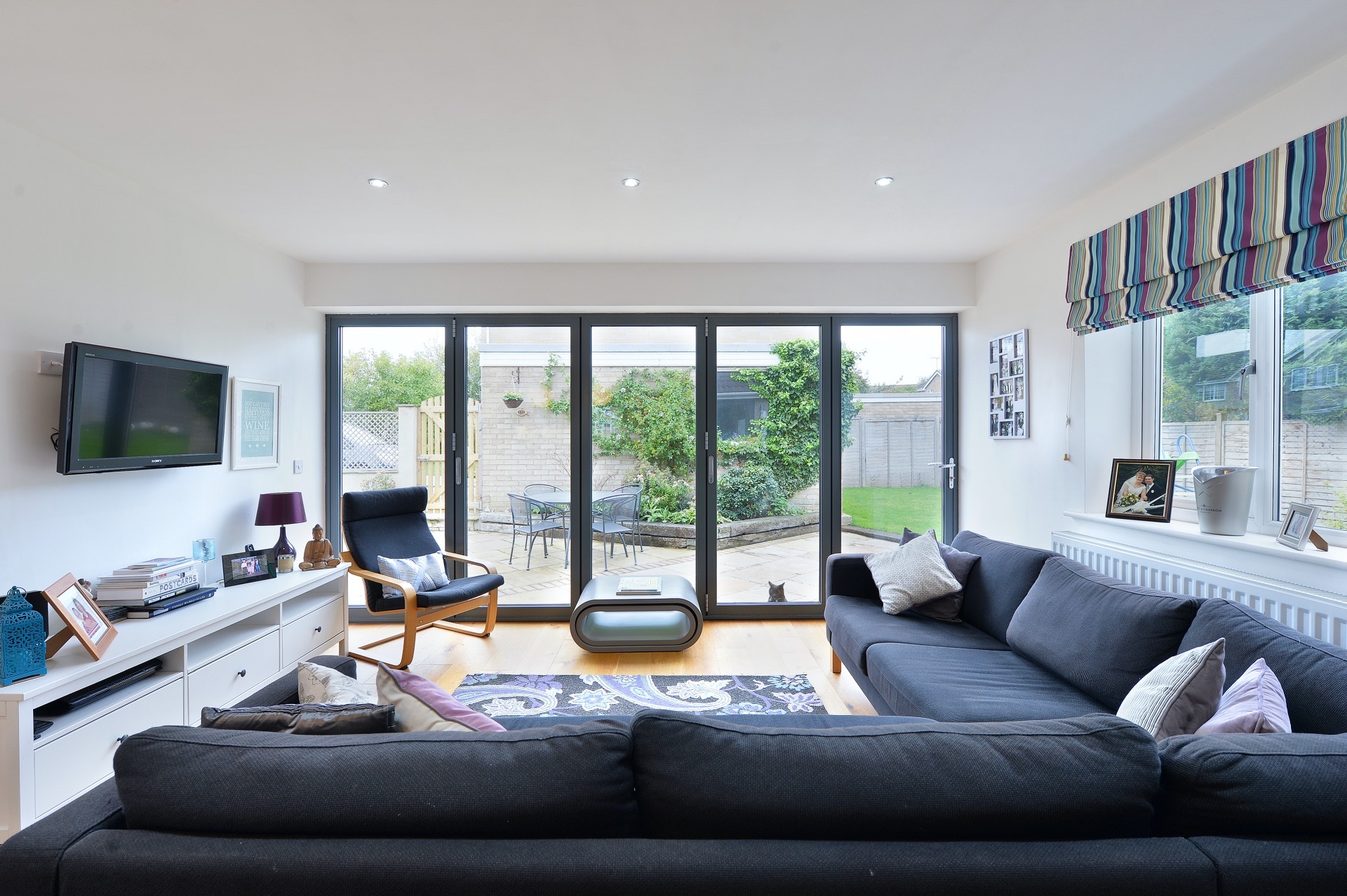 Family room with bifold doors leading on to garden