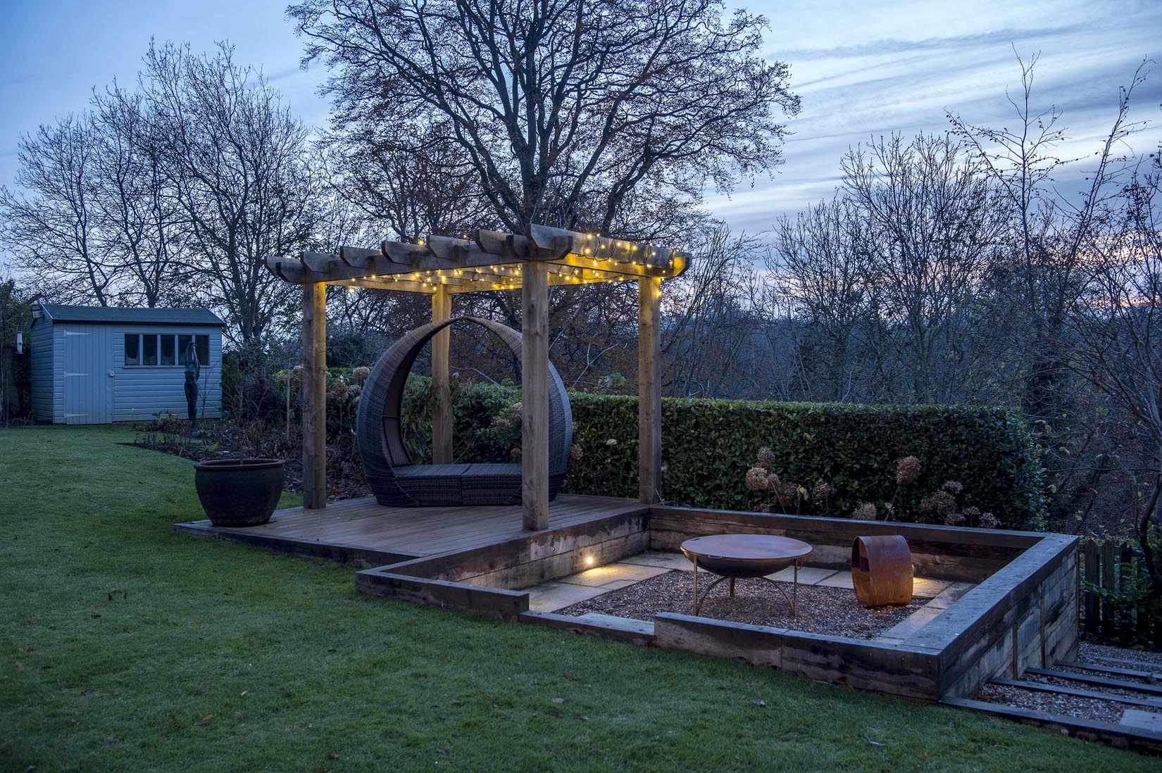 New seating area with oak pergola and lighting